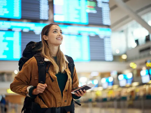 Student backpacking through an airport.