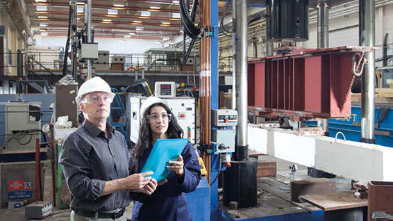 Students in workshop with hard hats