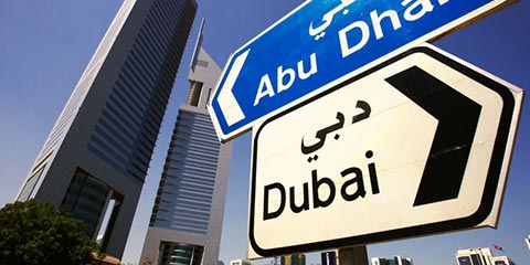 Signpost showing Abu Dhabi and Dubai
