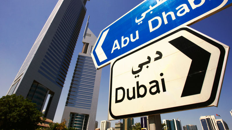 Signposts for Abu Dhabi and Dubai