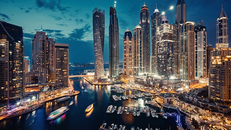 Dubai waterfront lit up at night