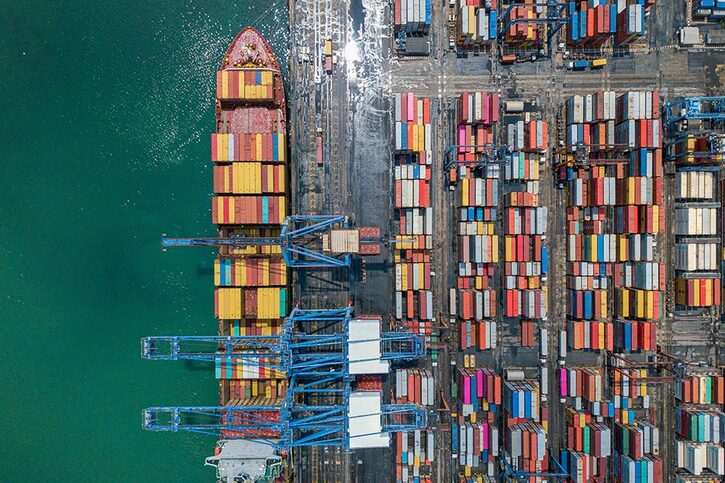 Aerial view of a container ship being loaded