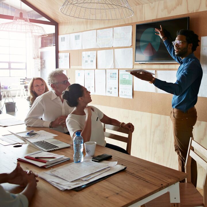 man gives marketing presentation