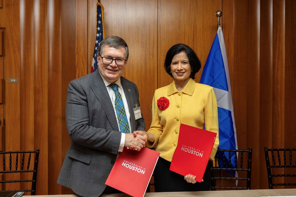 Heriot-Watt University's Principal Richard A Williams shaking hands with the president of the University of Houston.