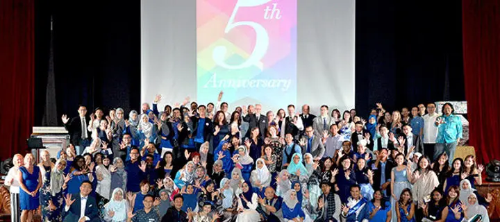 group shot of students celebrating the fifth anniversary