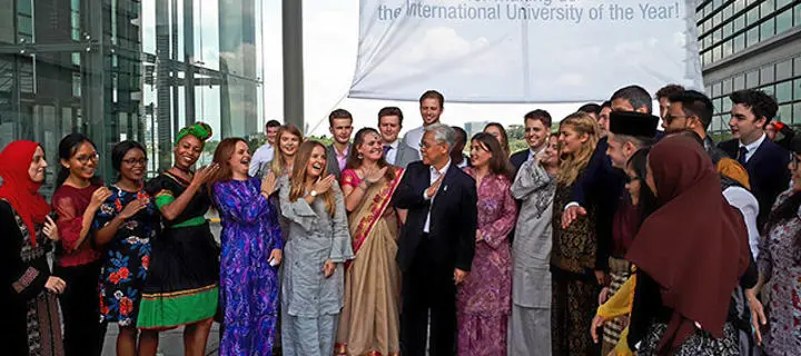 group shot of students celebrating winning International University of The Year