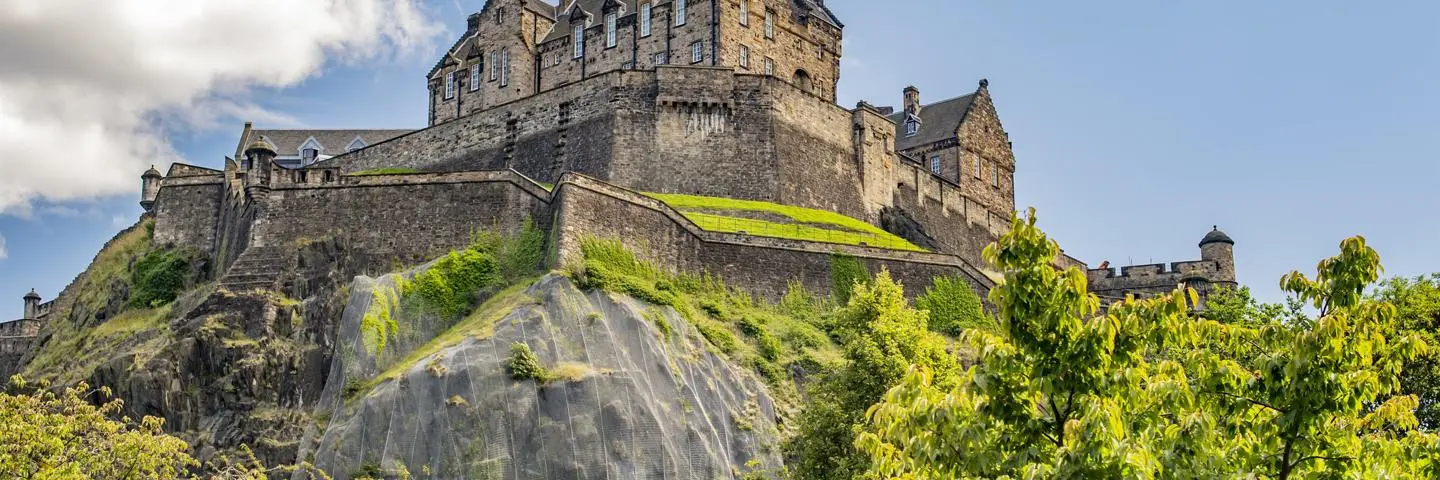 Edinburgh castle on a summer's day with blue sky.