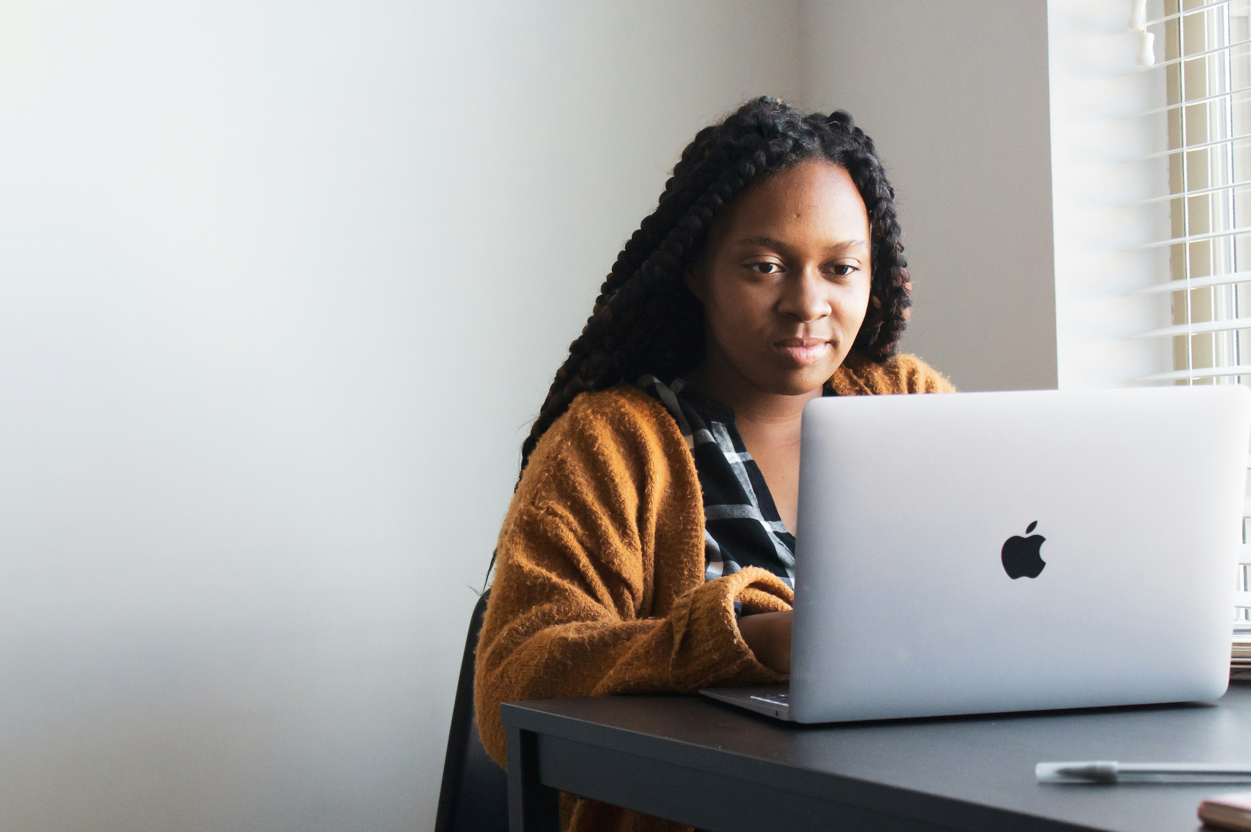 Student sitting in front of a laptop