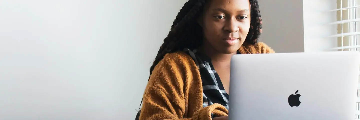 Student sitting in front of a laptop