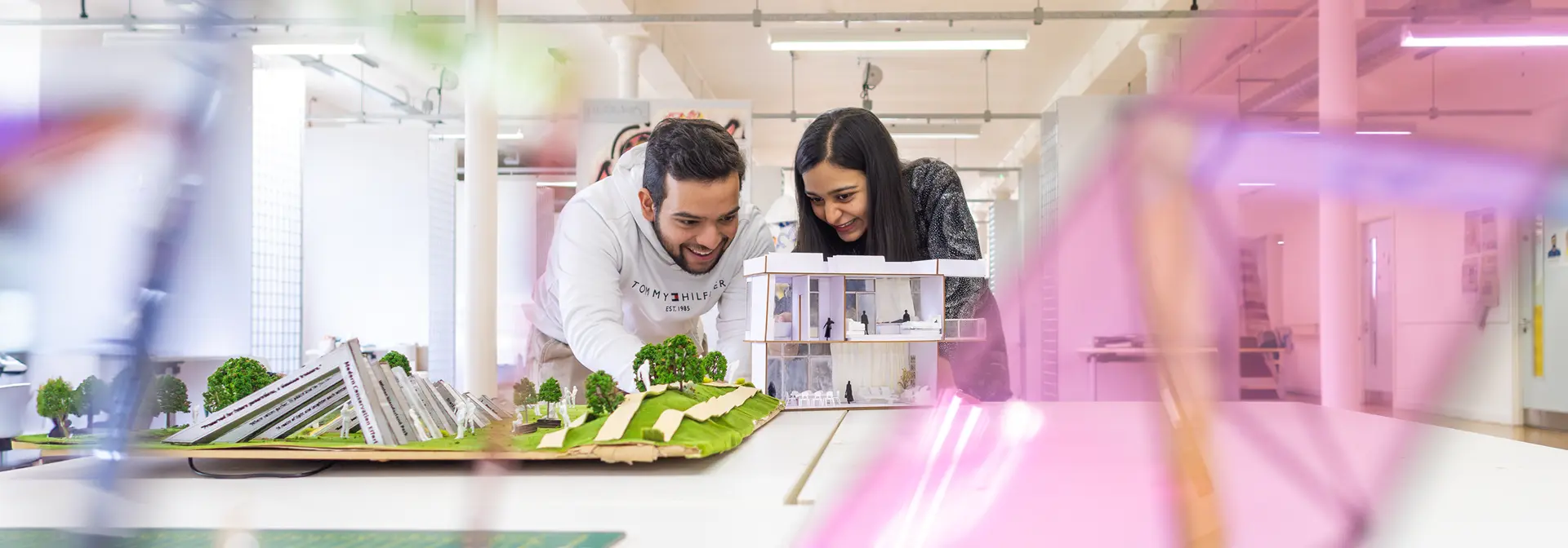 Two students looking at an architectural 3D model together