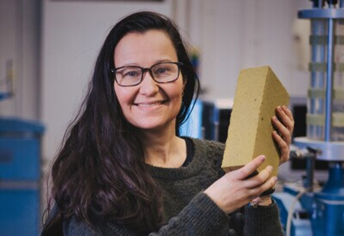 Professor Gabriela Medero holding a K-Briq
