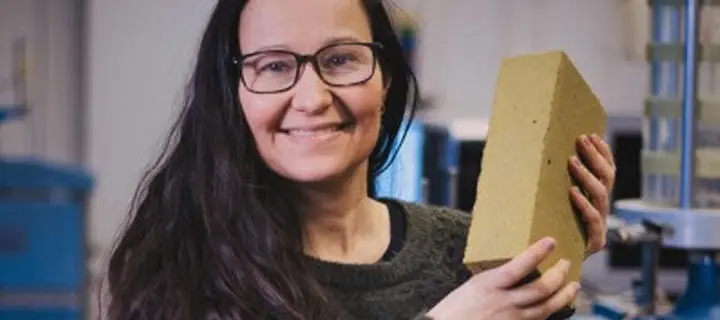 Professor Gabriela Medero holding a K-Briq