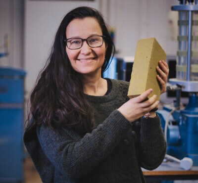 Professor Gabriela Medero holding a K-Briq