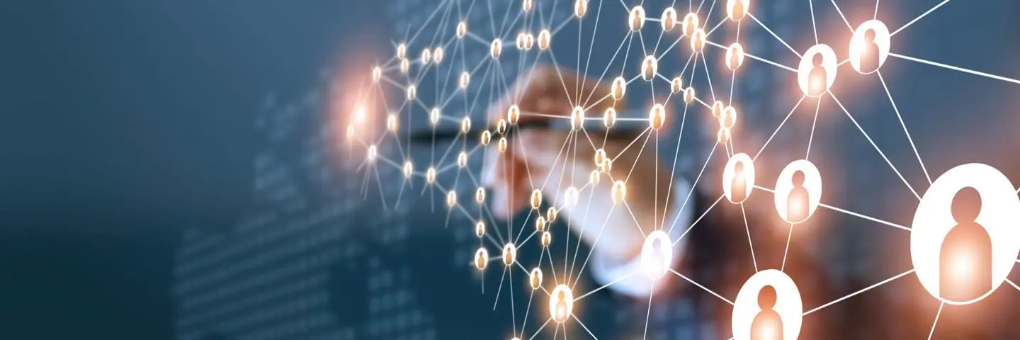 Abstract background featuring a hand holding a pen connecting dots of people to each other.