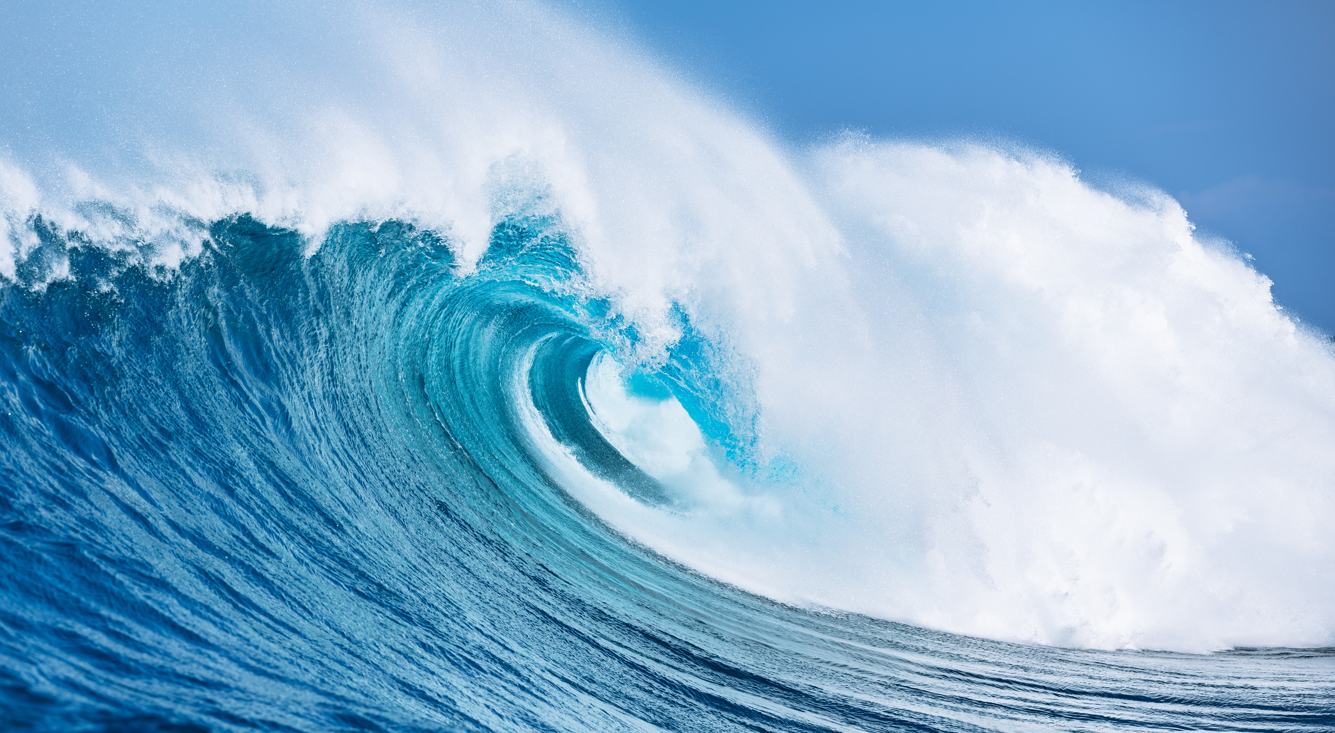 A big blue wave crashes down
