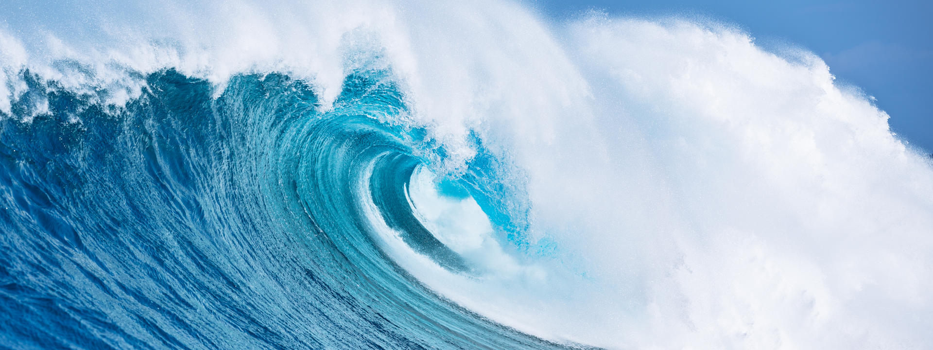 A big blue wave crashes down
