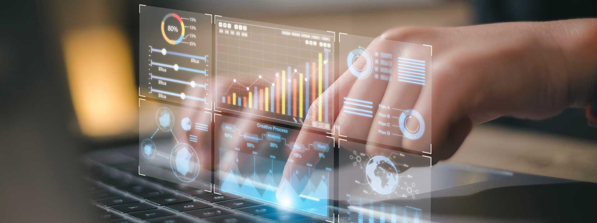 A person working on a laptop displaying a graph, focused on data analysis.