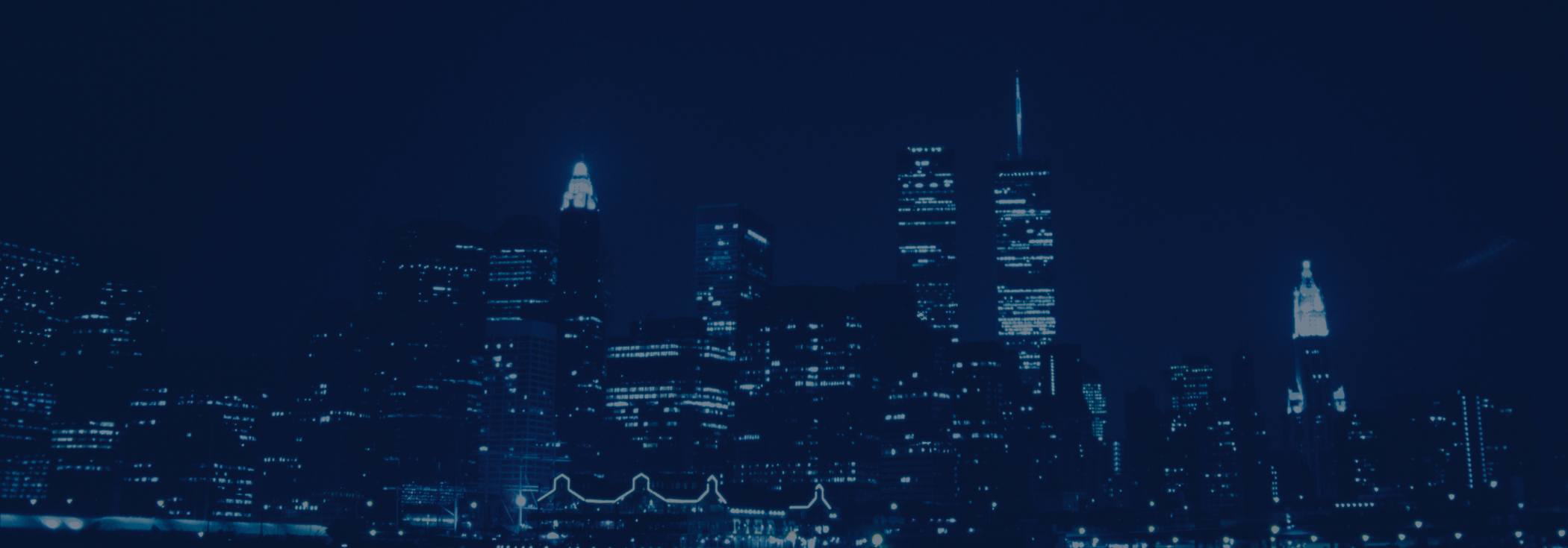 Blue skyscraper skyline at night.