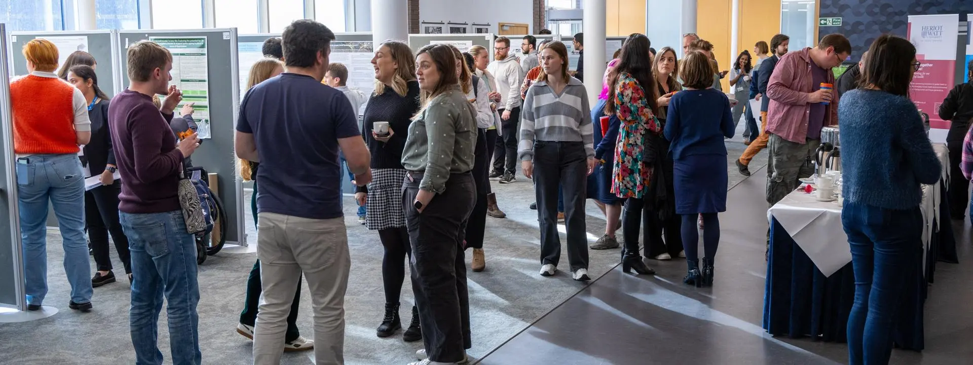 ECR Conference poster room with people gathered chatting
