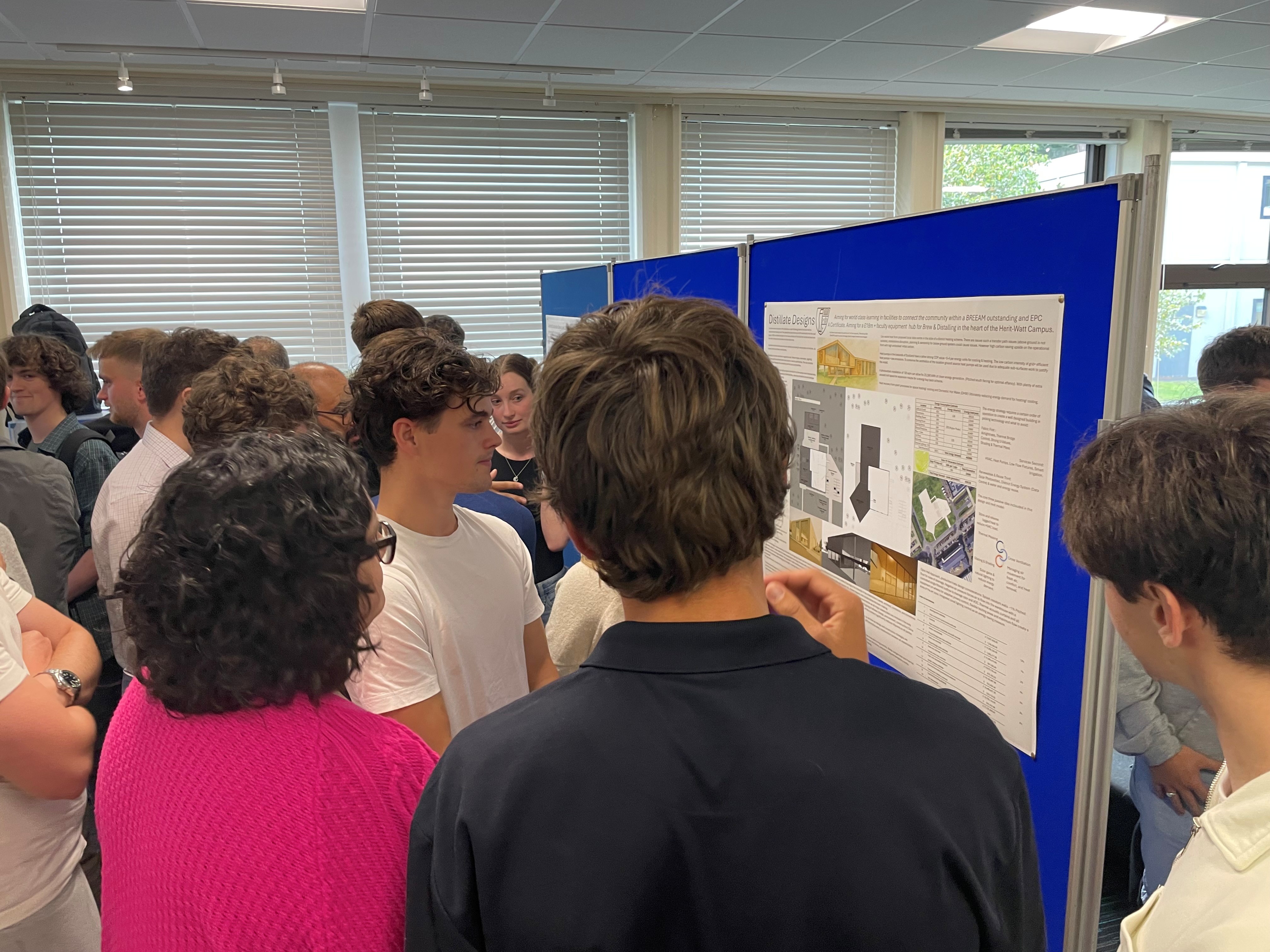 Students gathered round a poster