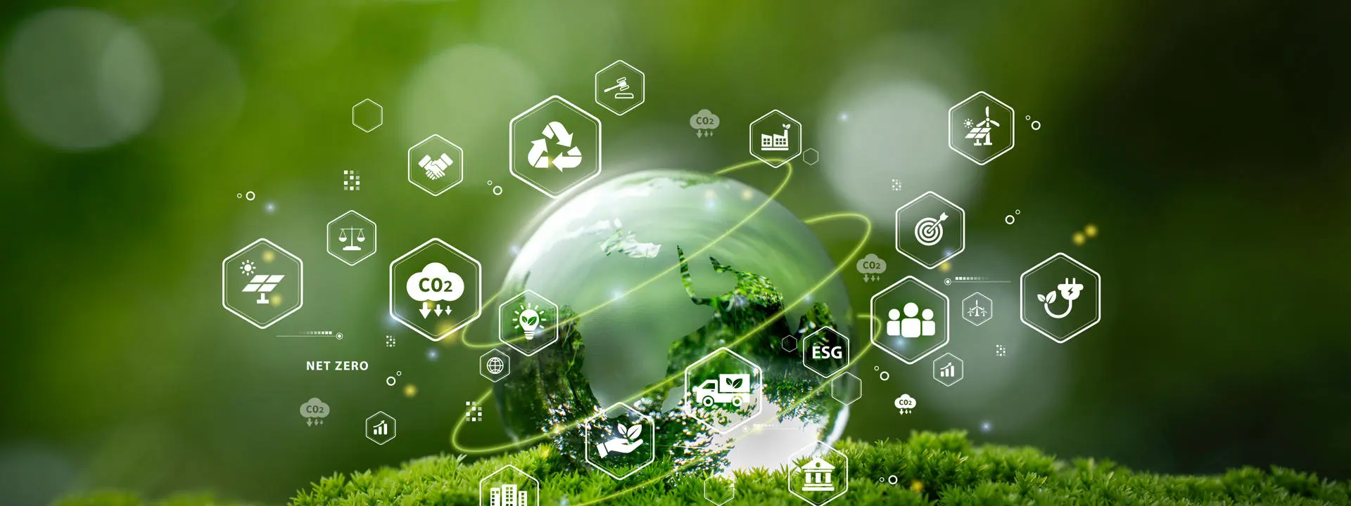 Glass globe on moss with eco and sustainability icons.