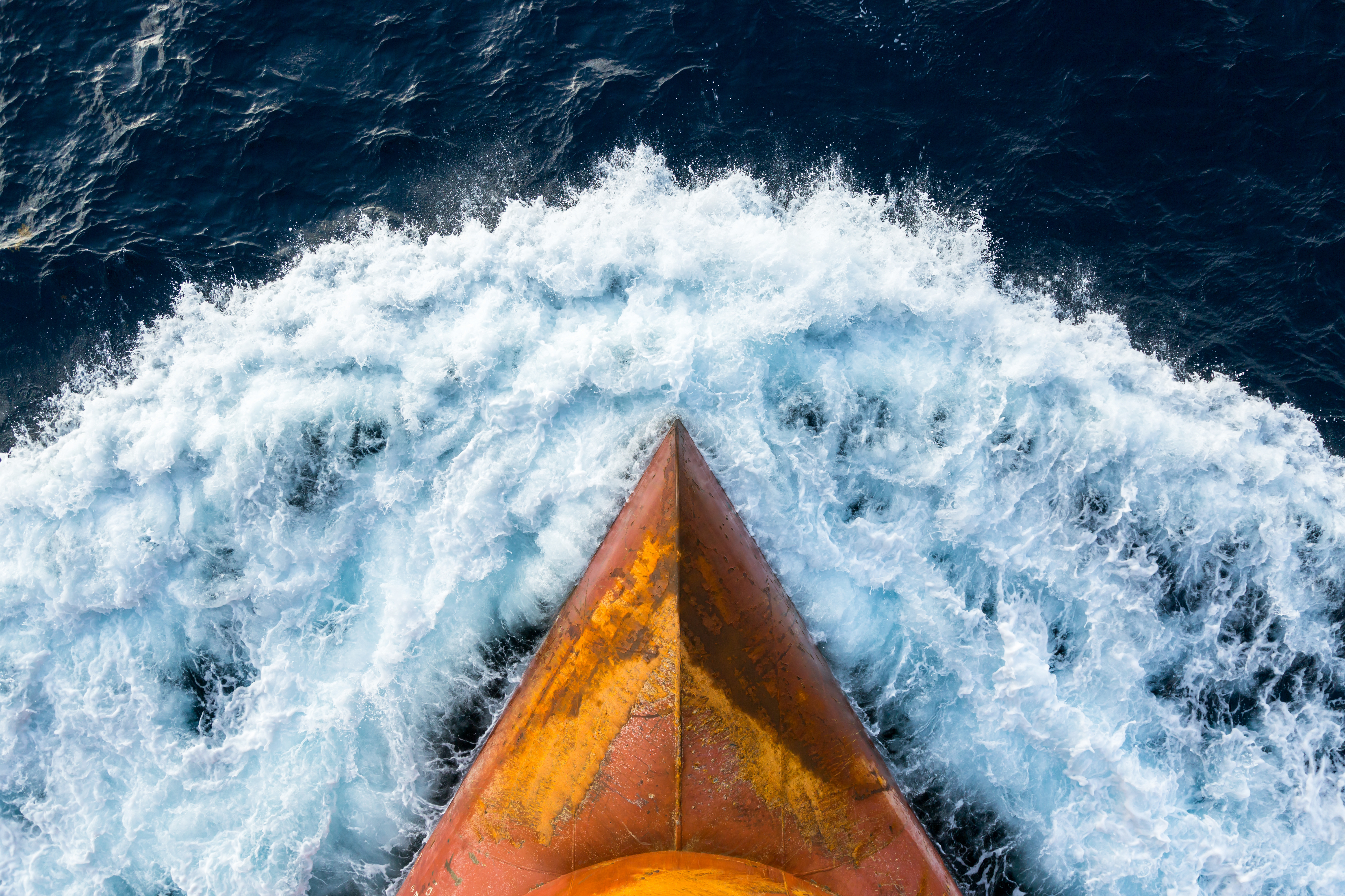 The bow of a ship sailing through water