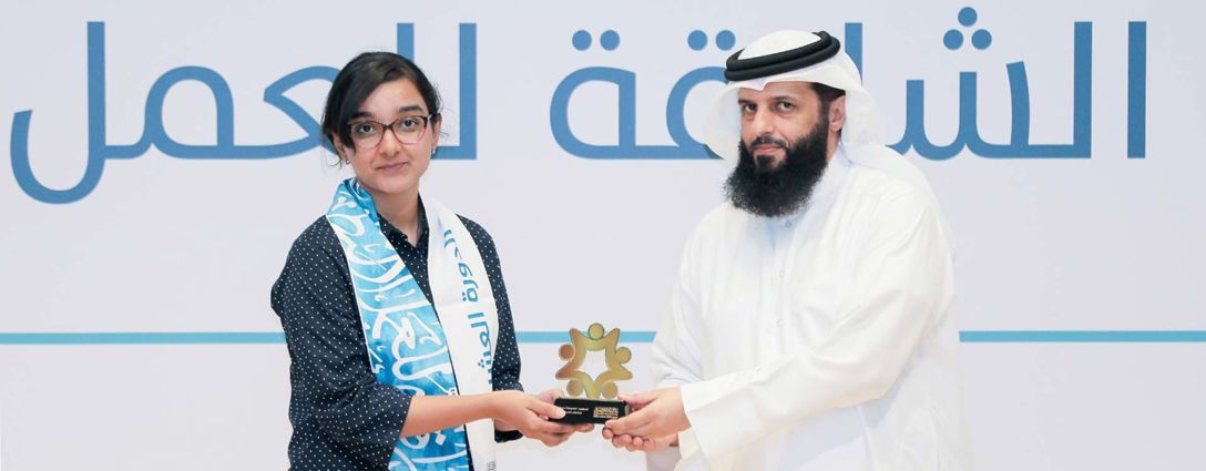 winner of the Sharjah Award for voluntary work Megna Rajagopal being presented with an award