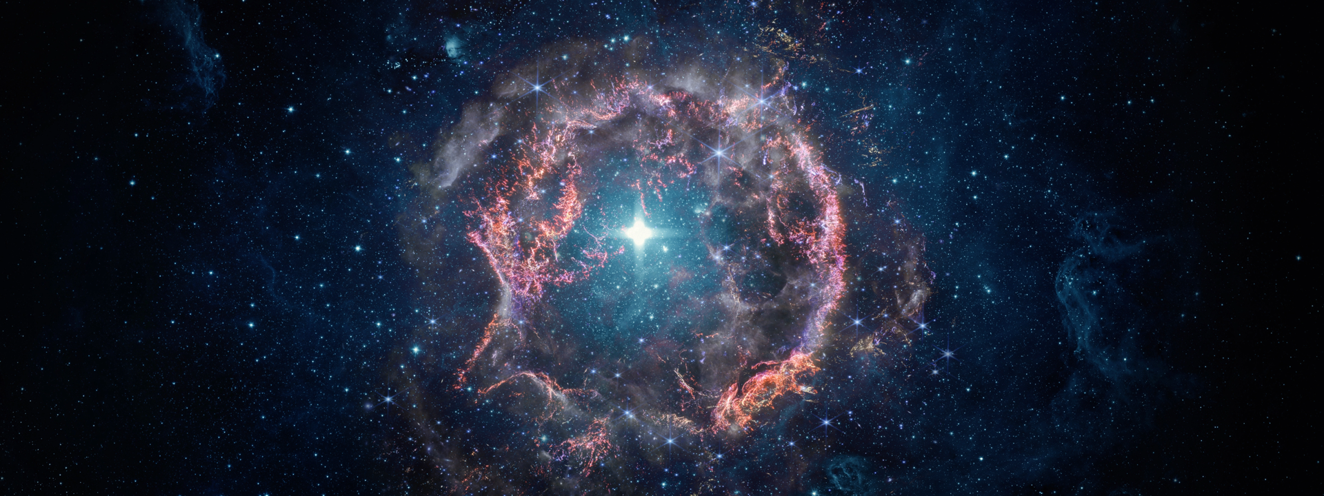 A stunning image of a glowing nebula and bright star surrounded by deep space and scattered stars.