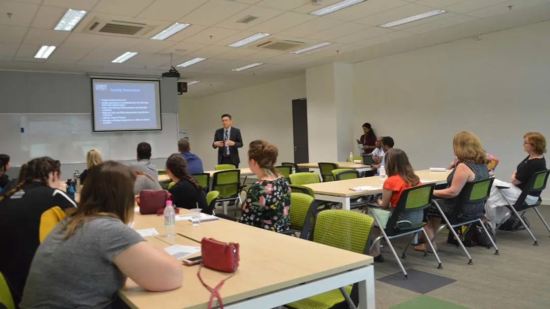 Students listening to a lecturer in a classroom