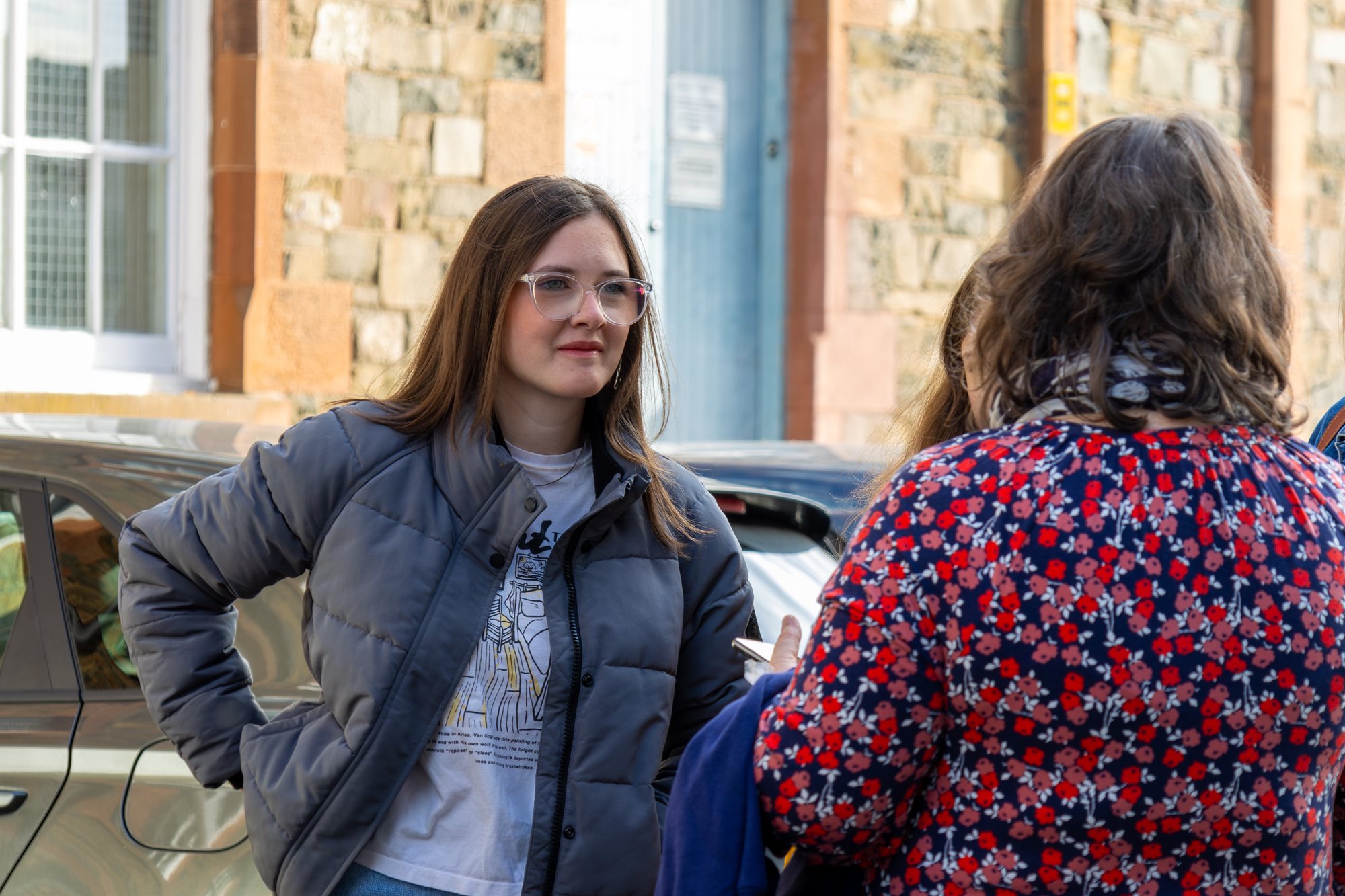 Prospective student at an open day speaking to staff.