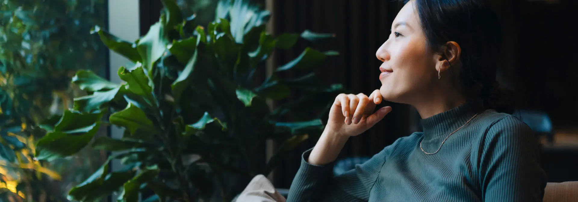 A person thinking in a cafe setting