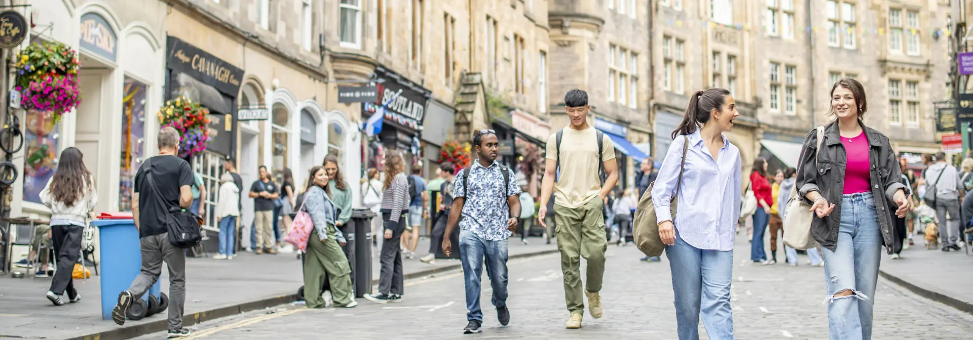 Students chat as they walk down Cockburn Street.