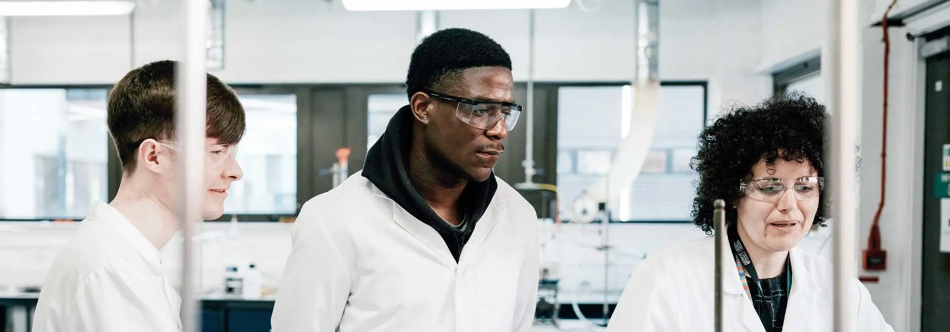 Three students study in the lab