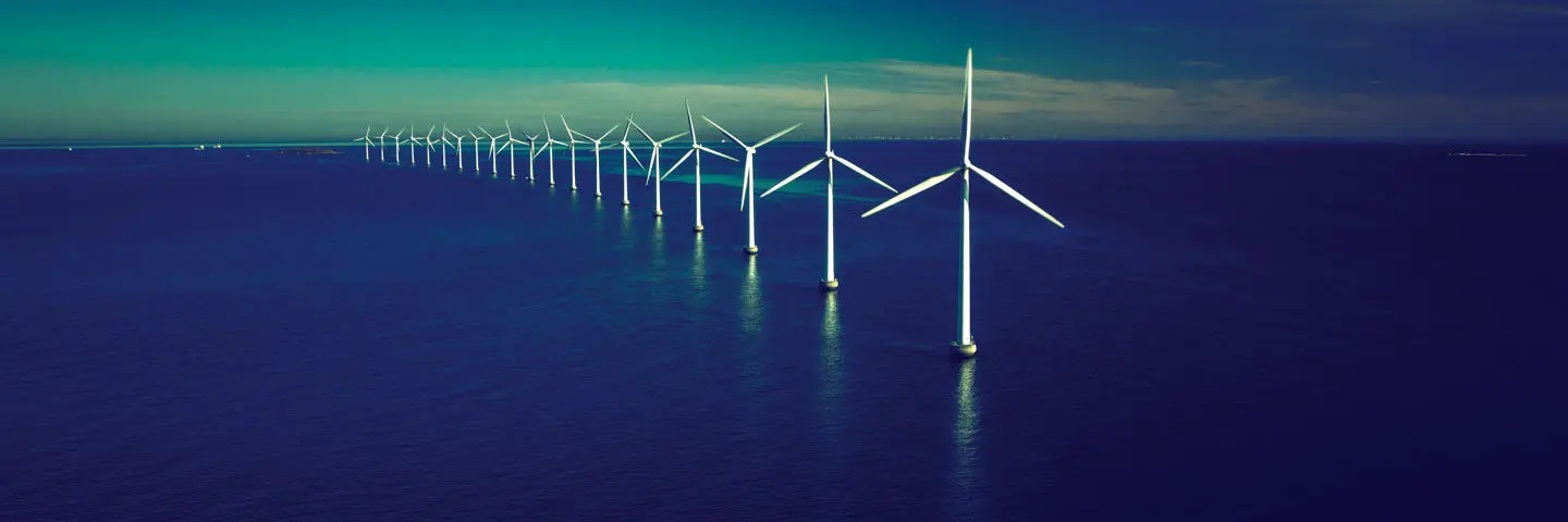 A row of offshore wind turbines