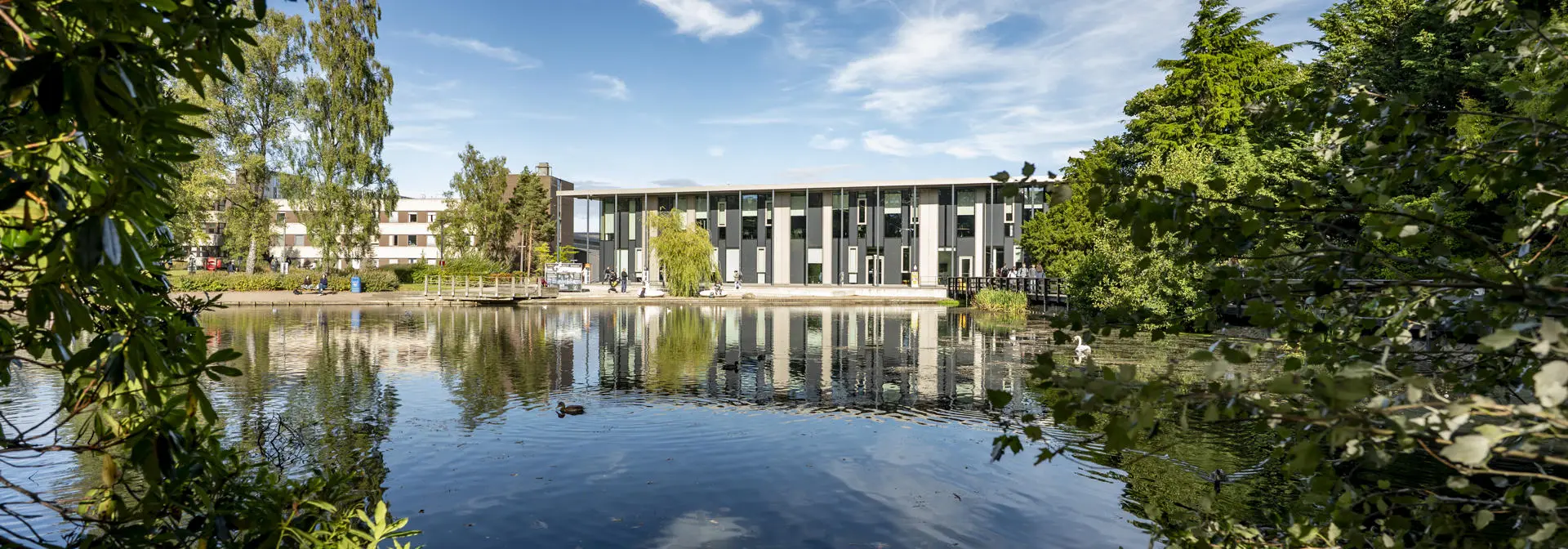 Shot of Heriot-Watt GRID building, with loch in the foreground