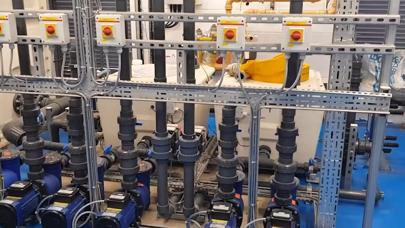 Vertical piping and filtration units at the Aquarium in the Lyell Centre