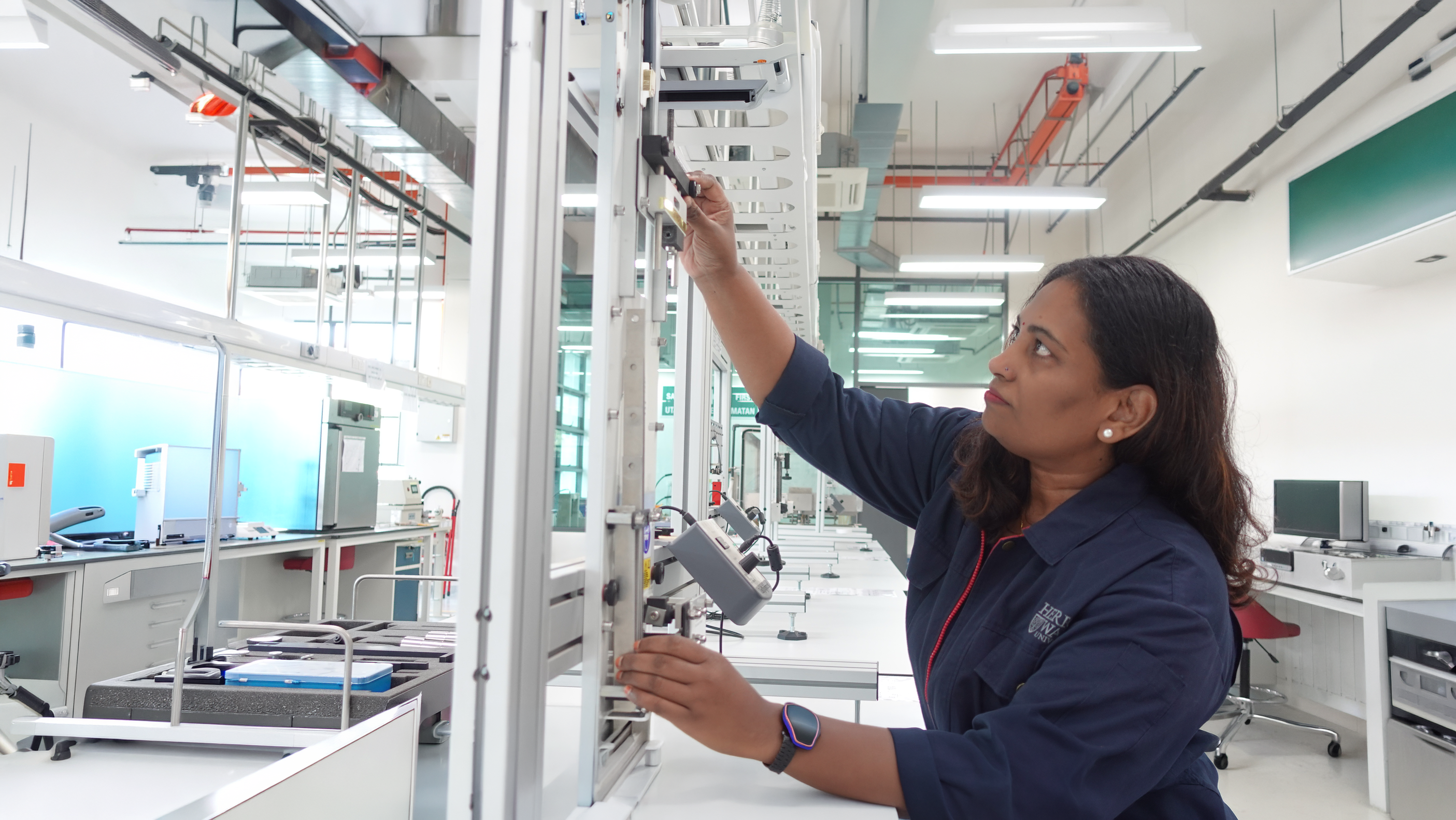 Revathai Amathalai, a Senior Laboratory Technician working in a lab on our Heriot-Watt Malaysia Campus
