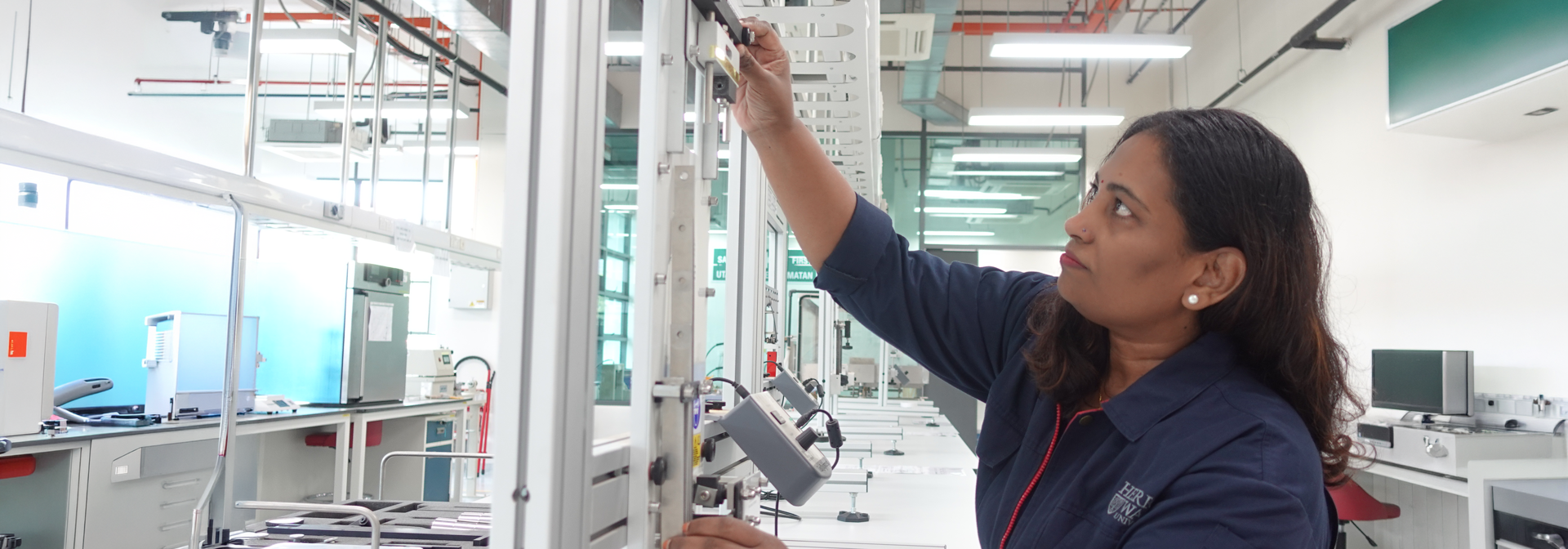 Revathai Amathalai, a Senior Laboratory Technician working in a lab on our Heriot-Watt Malaysia Campus