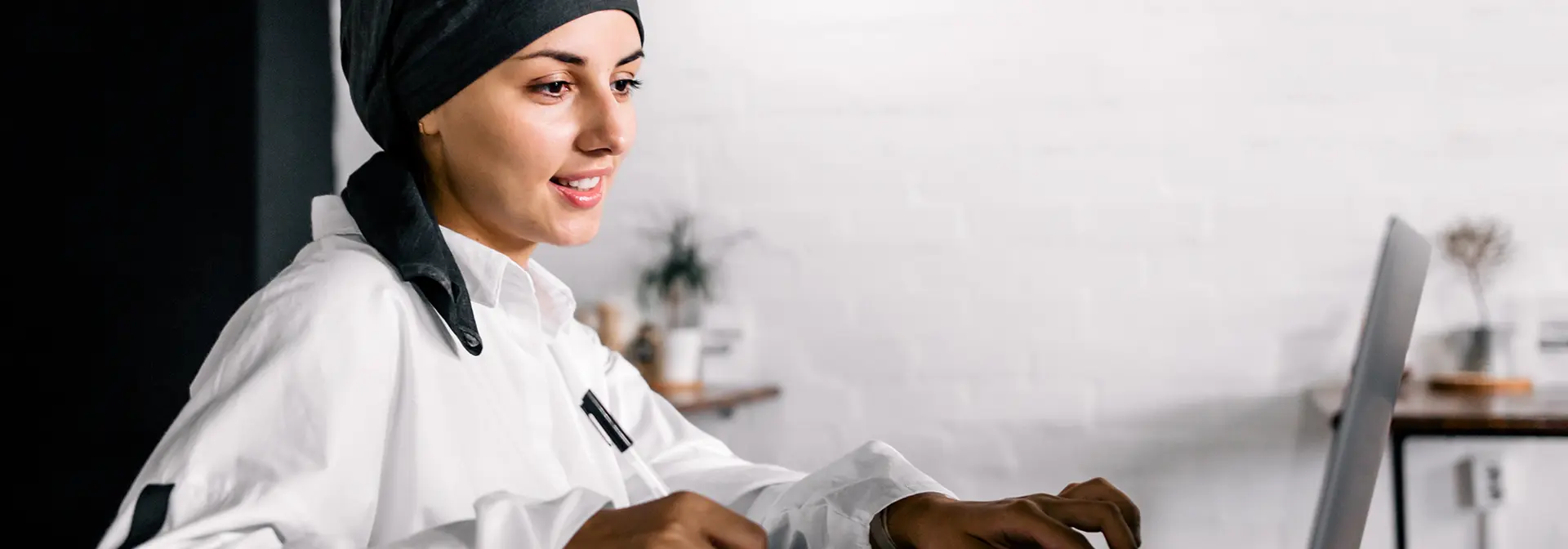 A woman working on a laptop