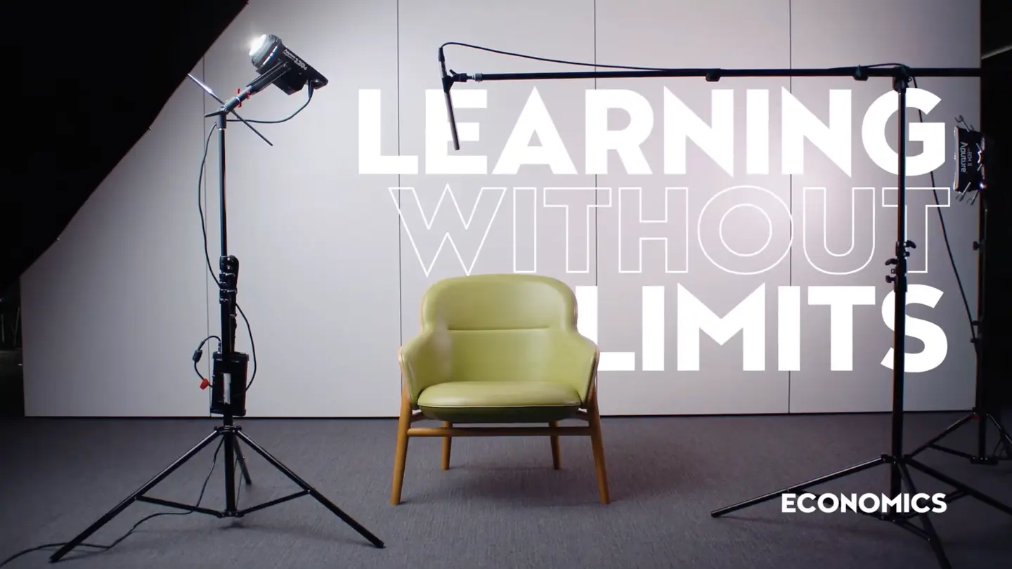 Video thumbnail with empty seat and soundstage with text 'Learning Without Limits: Economics.'