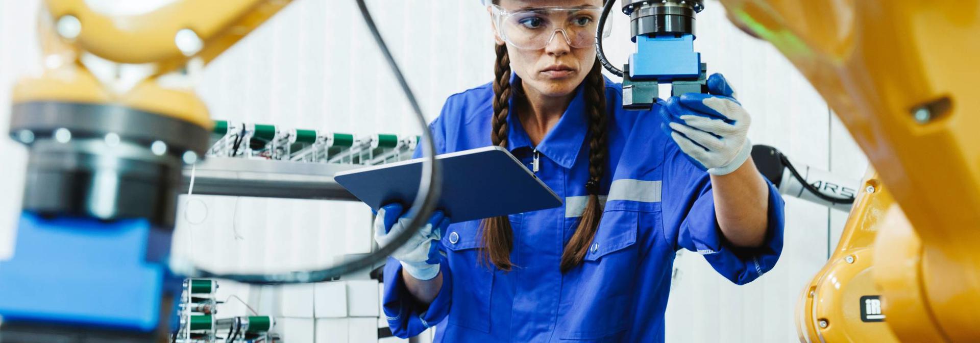 An industrial worker inspecting machinery