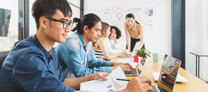 Several students working on laptops