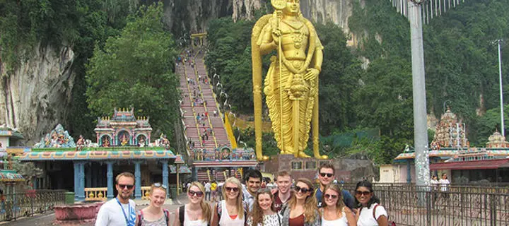 Students in front of shrine in Malaysia
