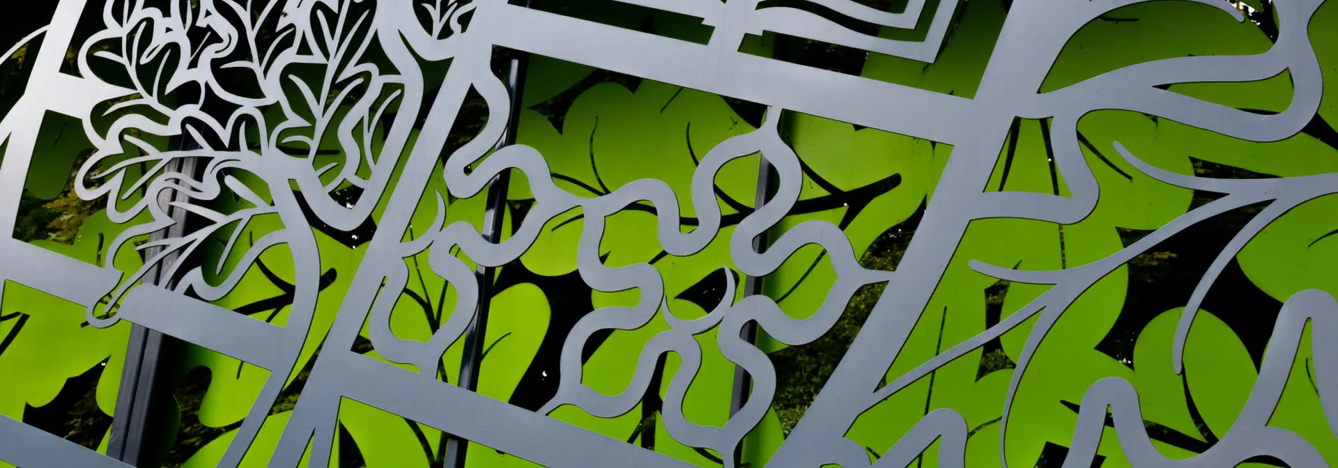 Close up picture of Heriot-Watt badge on wall display