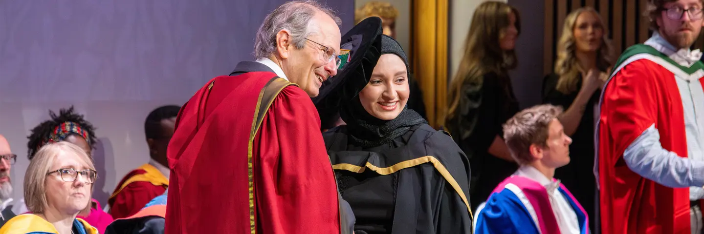Several students in graduation robes