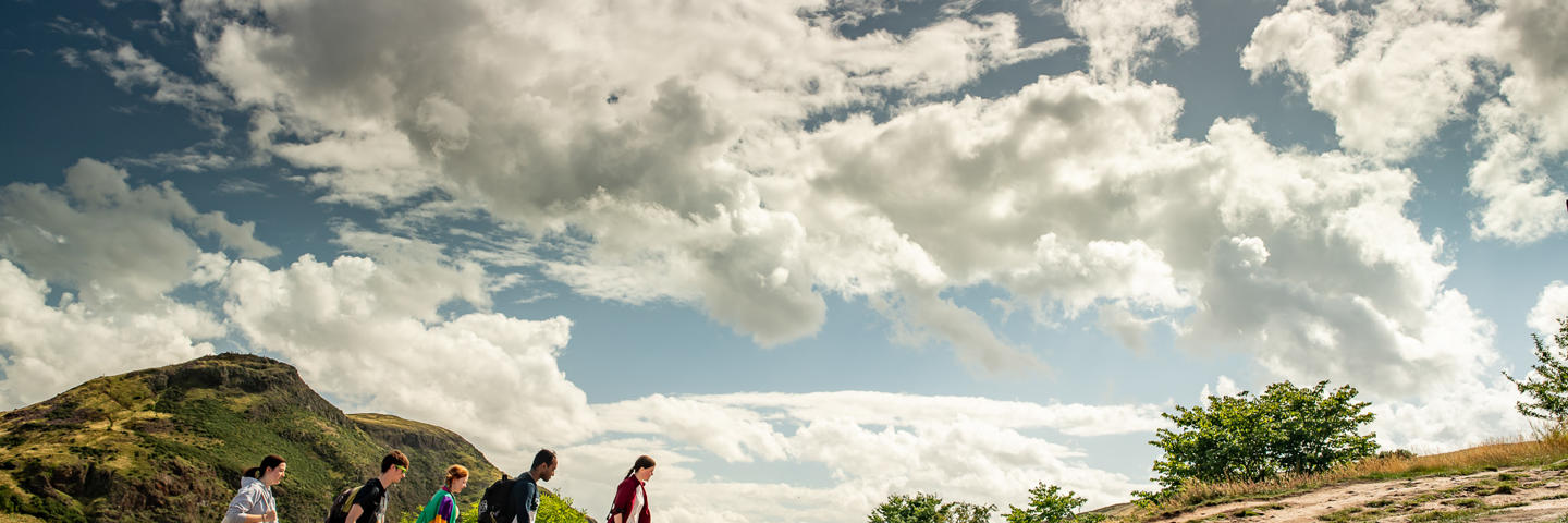 A group of students is climbing a hill
