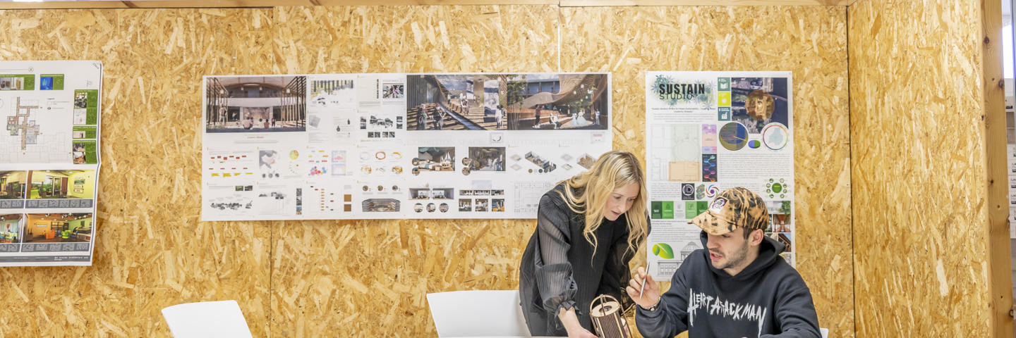 Two architecture students discussing design.