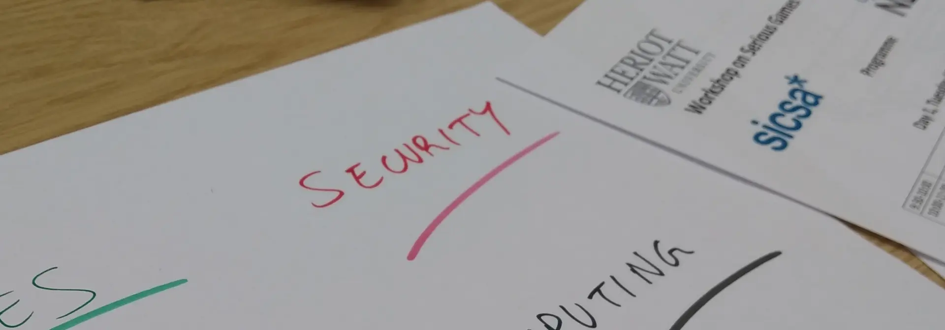 Heriot-Watt paper with the words 'security' and 'computing' written in pen.