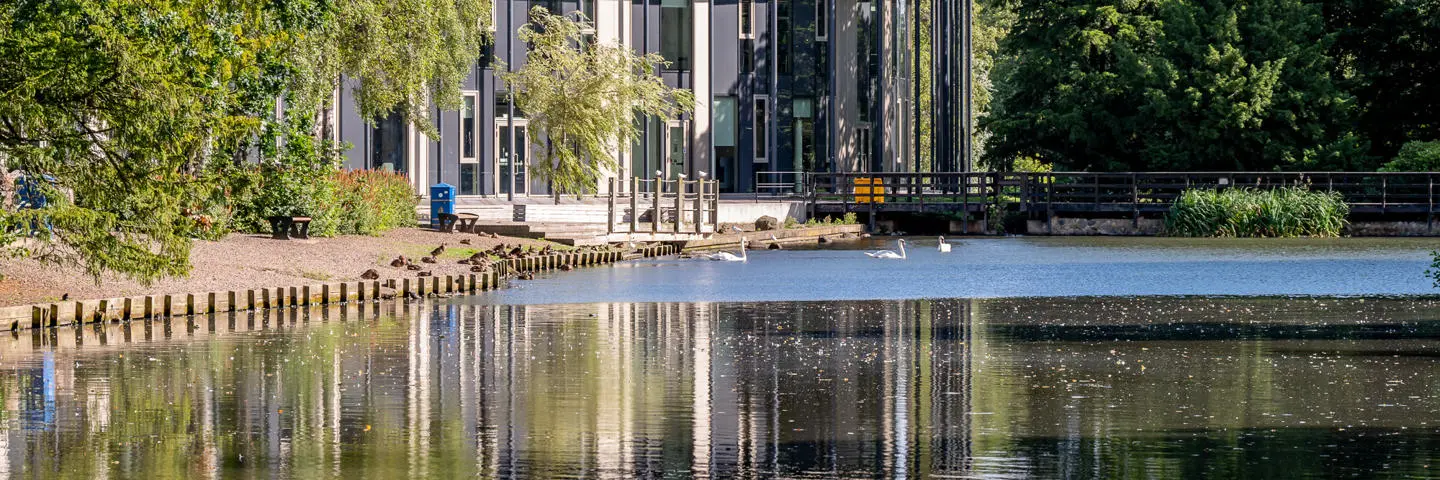 A loch beside a building.