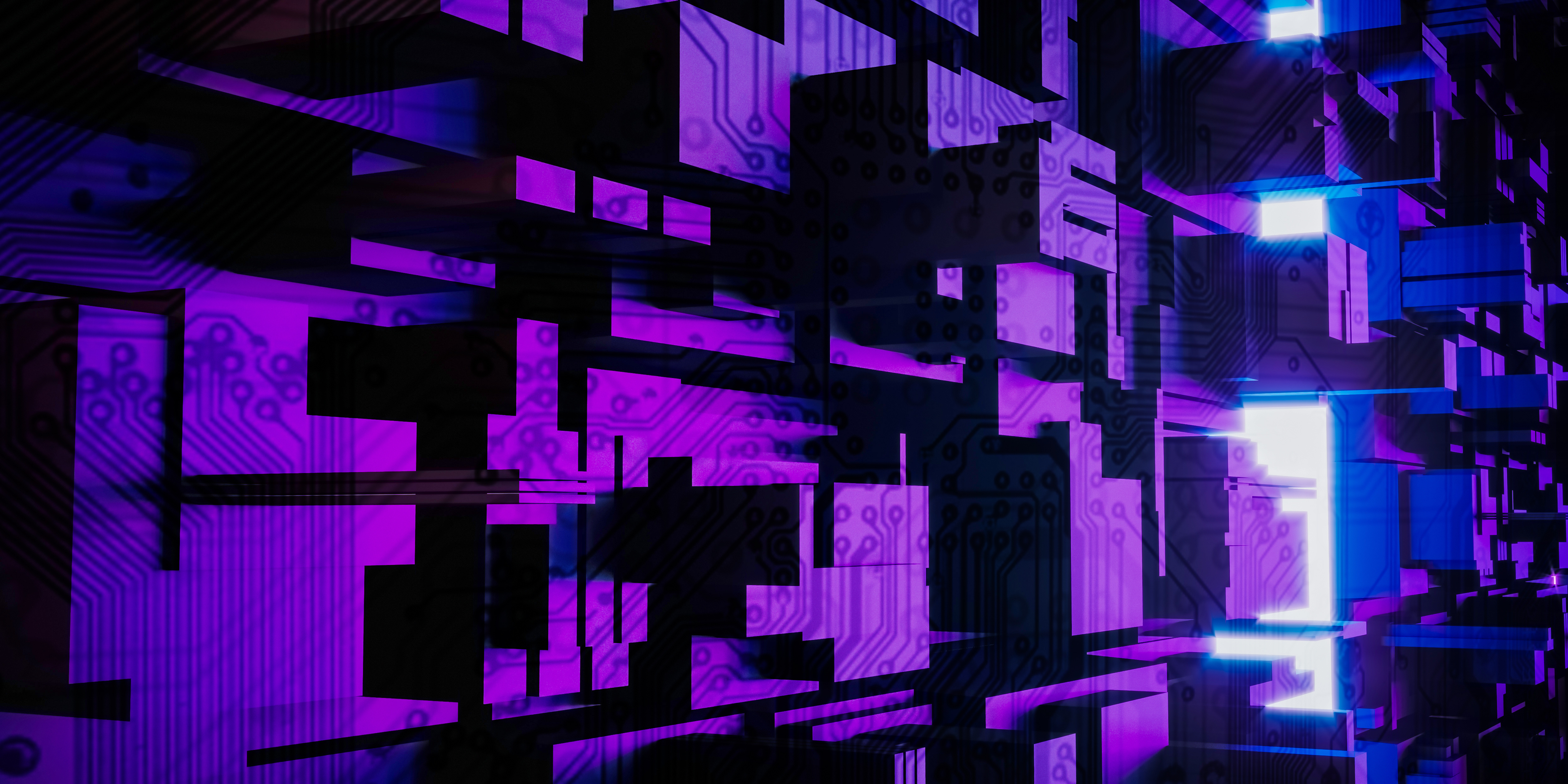 A complex network of computer chips illuminated in purple light 